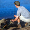 Angler quickly assembles a rod from a Quik-Cast rigged fly rod case