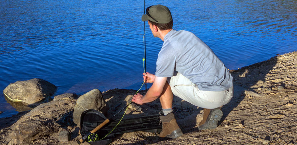 Angler quickly assembles a rod from a Quik-Cast rigged fly rod case